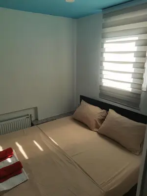 a bed with two pillows in a room with a window at ViP ROOMS PRENOCISTE 026 in Smederevo
