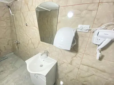 a bathroom with a sink and a mirror and a toilet at ViP ROOMS PRENOCISTE 026 in Smederevo