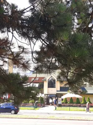 a blue car parked in front of a building at AVALA, New Belgrade in Fontana
