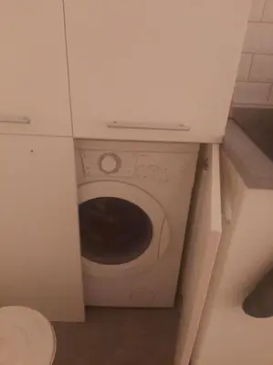 a washer and dryer in a small bathroom at AVALA, New Belgrade in Fontana