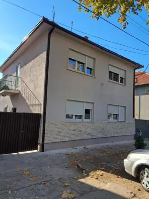 a white car parked in front of a house at danguba 2 in Nova Pazova