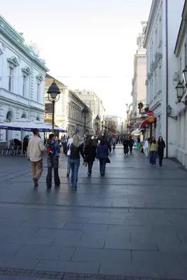 a group of people walking down a city street at Itaka - Belgrade City Center in Belgrade