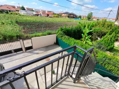 a staircase leading up to a balcony with a view of a field at A1 - Airport Belgrade Apartment in Belgrade