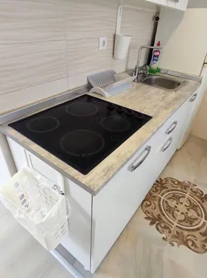 a kitchen with a stove and a sink at A1 - Airport Belgrade Apartment in Belgrade