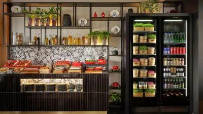 a display case in a store filled with lots of food at Radisson RED Belgrade in Belgrade