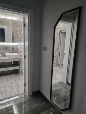 a bathroom with a mirror and a sink at Up Hostel in Belgrade