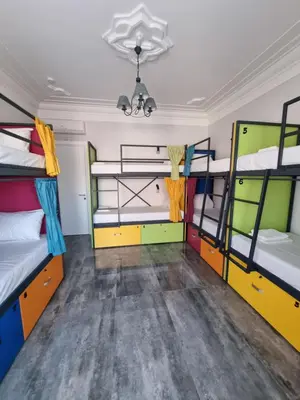 a room with four bunk beds and a ceiling at Up Hostel in Belgrade