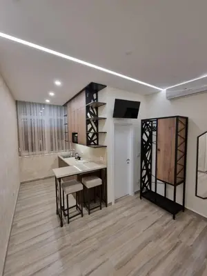 a large kitchen with a sink and a table at Up Apartments in Belgrade