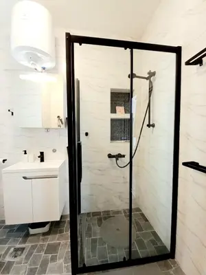 a bathroom with a shower and a sink at GENIUS STUDIO in Belgrade