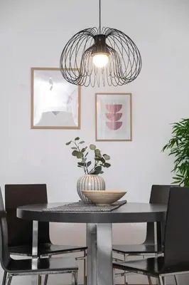 a dining room with a black table and chairs at Apartment GREEN in Belgrade