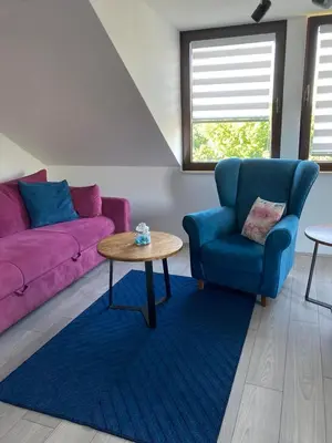 a living room with a couch and a table at Galerija Park 2 in Arandjelovac