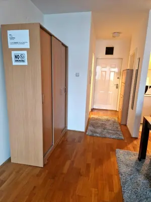 a room with a door with a no dogs sign on it at Anchy Apartment in Belgrade