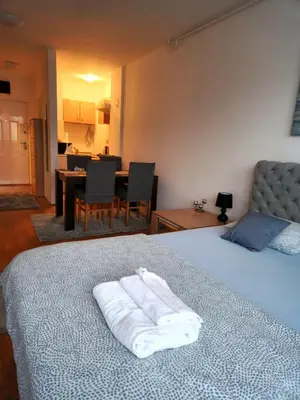 a bedroom with a bed with two towels on it at Anchy Apartment in Belgrade