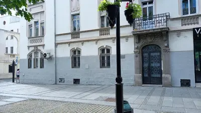 a building with a black door on a street at Fortress 1: Quiet, Lux 50m2 , apartment in the pedestrian zone in Belgrade