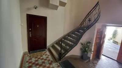 a hallway with a spiral staircase and a door at Fortress 1: Quiet, Lux 50m2 , apartment in the pedestrian zone in Belgrade
