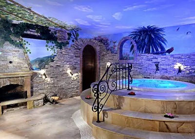 a room with a hot tub in a stone building at S Club Resort Hotel Aqua Park and Spa in Belgrade