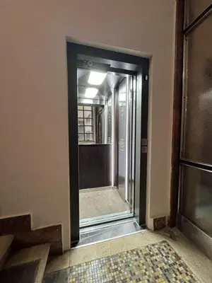 an empty hallway with a glass door in a building at Studio apartment Financial Park Belgrade in Belgrade