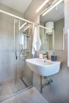 a bathroom with a sink and a shower at Studio apartment Financial Park Belgrade in Belgrade