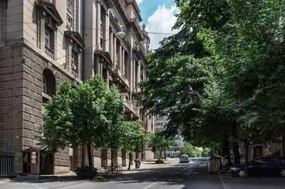 an empty street in a city with a building at Studio apartment Financial Park Belgrade in Belgrade