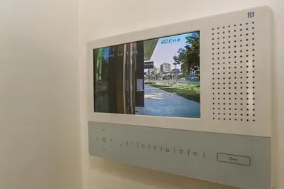 a television with a screen on a wall at Apartment Atrium- A blok in Novi Beograd