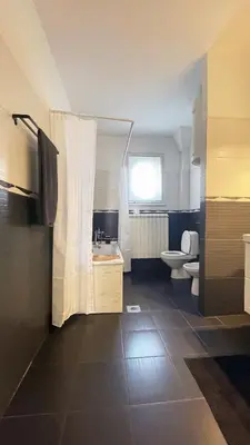 a bathroom with a sink and a toilet at Alva Lux Apartment in Belgrade