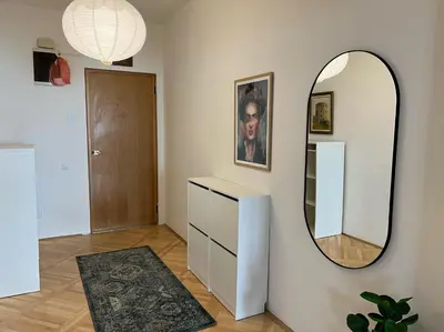a dressing room with a mirror and a dresser at Alva Lux Apartment in Belgrade