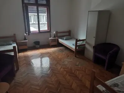 a room with a bedroom with a bed and a window at Cozy place 1 in Belgrade