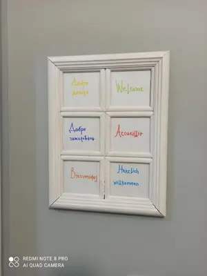 a white refrigerator with different words on it at Apartment Tesla Space in Belgrade