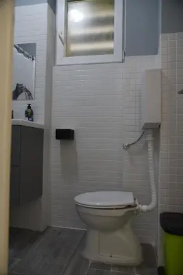 a bathroom with a toilet and a sink at Apartment Tesla Space in Belgrade
