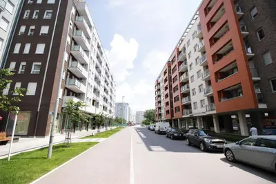 a street in a city with tall buildings at Apartment Delta City Tata New Belgrade in Belgrade