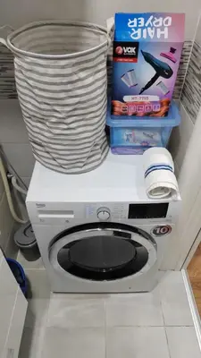 a washing machine with a basket on top of it at Bamsae Belgrade in Vračar (historical)