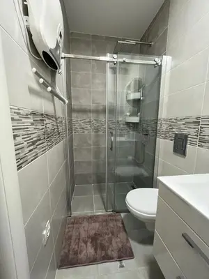a bathroom with a shower with a toilet and a sink at Bamsae Belgrade in Vračar (historical)