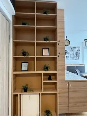 a book shelf in a room with potted plants at Delete 5 - Zemunske Kapije in Belgrade