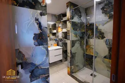 a bathroom with a shower and a sink at DeLux Center Apartments Inđija in Inđija