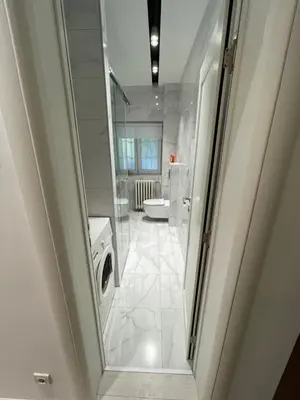 a bathroom with a shower and a washing machine at Belgrade Nest D&A in Belgrade