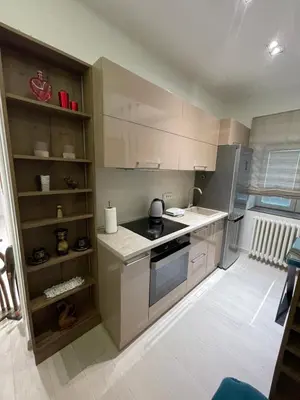 a kitchen with white cabinets and a stove at Belgrade Nest D&A in Belgrade