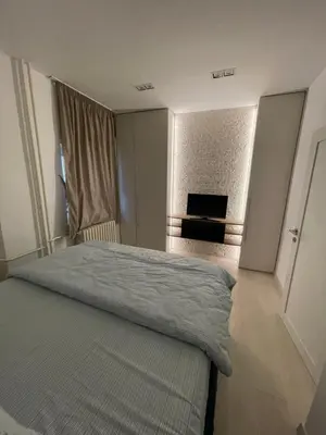 a bedroom with a bed and a fireplace in it at Belgrade Nest D&A in Belgrade