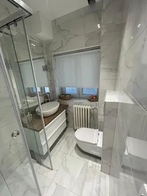 a bathroom with a shower and a toilet and a sink at Belgrade Nest D&A in Belgrade