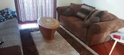 a living room with a couch and a table at Gajica konak-Orasac in Arandjelovac
