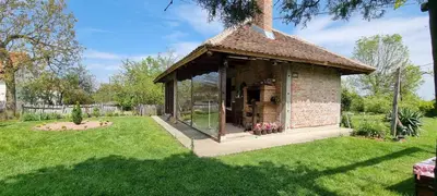 a gazebo in a yard with green grass at Gajica konak-Orasac in Arandjelovac