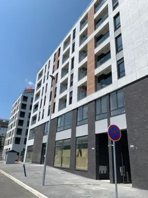 a tall building with a street sign in front of it at Selena apartment in Belgrade