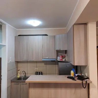 a kitchen with a sink and a counter top at Relax 2 besplatan parking in Obrenovac