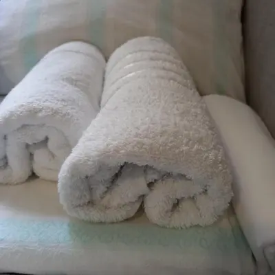 a group of white towels sitting on a counter at Rivijera in Belgrade