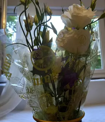 a vase with flowers in it on a table at Rivijera in Belgrade