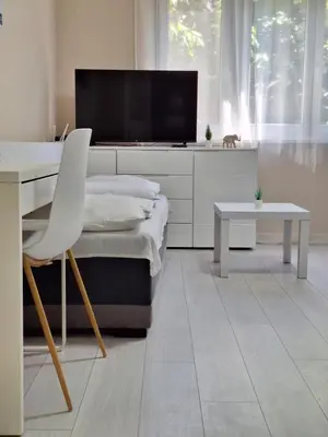 a room with a desk and a tv and a chair at Rivijera in Belgrade