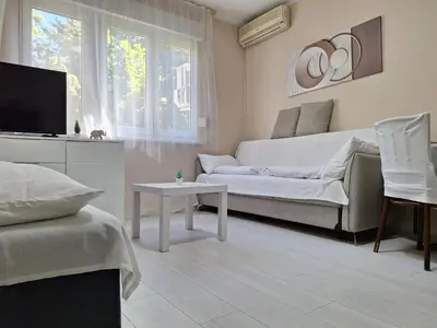 a living room with a couch and a tv at Rivijera in Belgrade