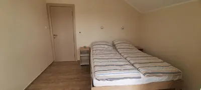 a large bed in a room with a bed sidx sidx sidx at River Casa in Ledine