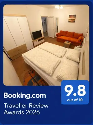 a hotel room with a bed and a couch at Apartman Anastasija in Surčin
