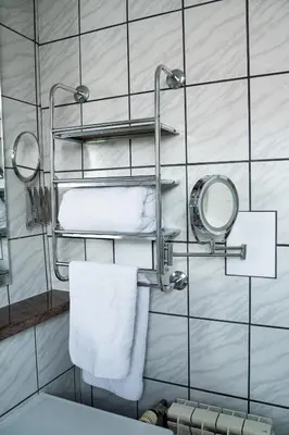 a bathroom with a towel rack and a sink at Family / Coworking Retreat Belgrade in Belgrade