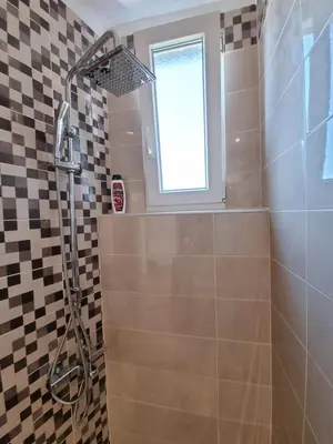 a bathroom with a shower and a window at Sunset in Belgrade